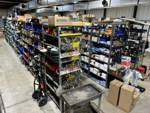 Stocked commercial truck parts shelving inside Johnson Truck & Trailer in Lowell, Arkansas