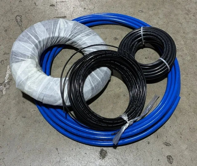Coils of hydraulic hose and tubing prepared for commercial applications